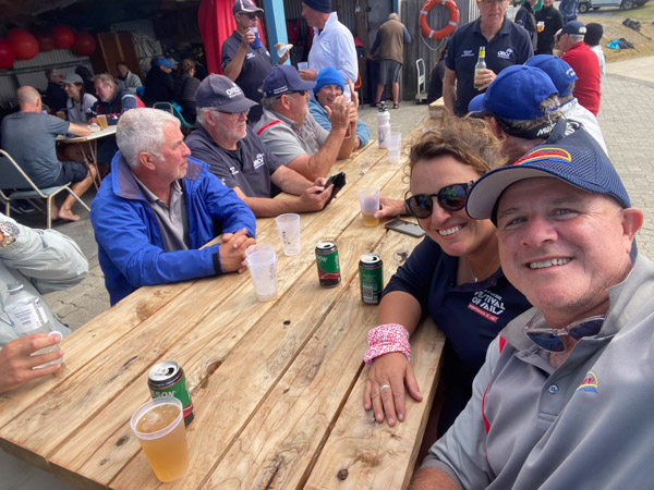 Shaun McKenna and Belinda Duivenvoorden with fellow sailors at t Shaun McKenna and Belinda Duivenvoorden with fellow sailors at the King Island Boat Club post-race celebrations, Grassy Harbour, Tasmania, 2025