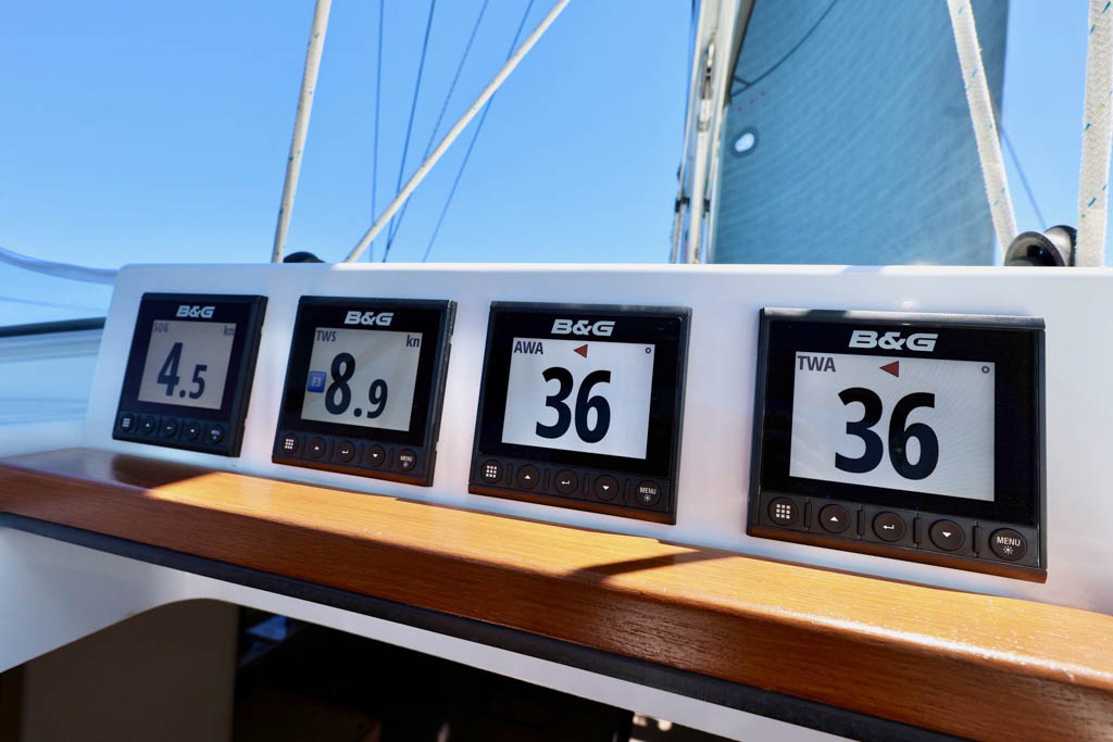 Four B&G Triton Instruments on Cabin Top Four digital B&G Triton multi-display instruments mounted in a neat row in a custom fiberglass panel on the cabin top above the companionway slider of a Hanse 458 yacht.