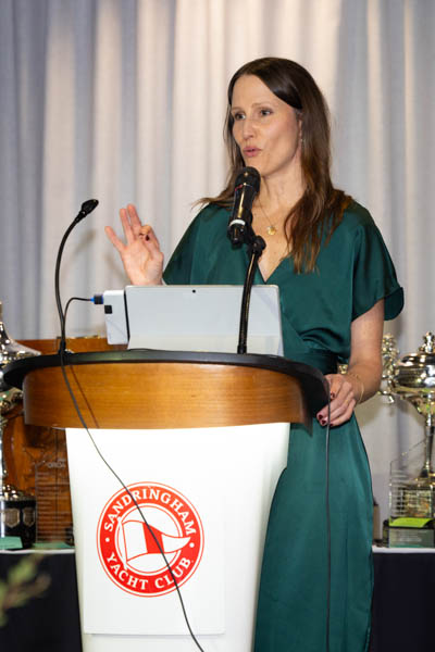 Jolene George speaking into a microphone while hosting the 2026 ORCV Annual Awards Evening at Sandringham Yacht Club.