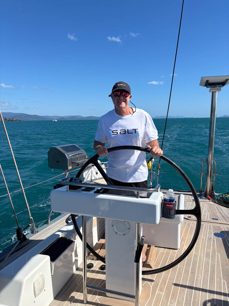 Shaun McKenna Helm – Swan 82 Crackerjack V Transit Shaun McKenna at the helm of Swan 82 yacht Crackerjack V sailing from Airlie Beach to Hamilton Island.